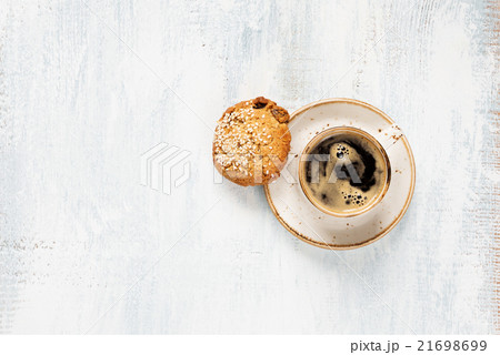 Black coffee and oatmeal cookie 21698699