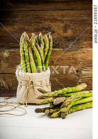 Fresh Green asparagus in a bunch and lots Fresh Green asparagus in a bunch and lots 21699367
