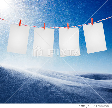 Blank paper or photo frames hanging on the red 21700890