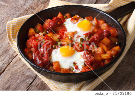 Huevos a la flamenca, closeup. Horizontal Huevos a la flamenca, closeup. Horizontal 21705196