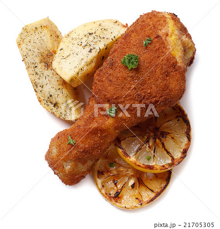 crumbed chicken leg with fried potatoes  isolated 21705305