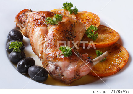 delicious fried rabbit leg with oranges, closeup delicious fried rabbit leg with oranges, closeup 21705957
