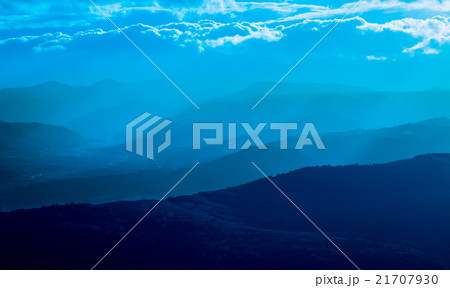 mountain silhouette with fog 21707930