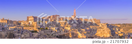 panoramic view of typical stones and church of Matera and the Madonna de Idris under begin sunset sky 21707932