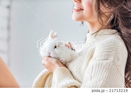 women with rabbit 21713219
