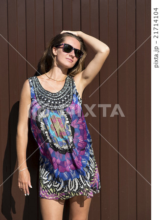 Beautiful young woman with glasses standing in 21714104