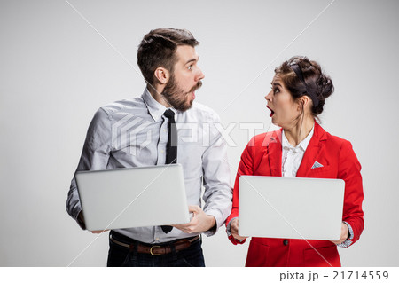 The young businessman and businesswoman with 21714559