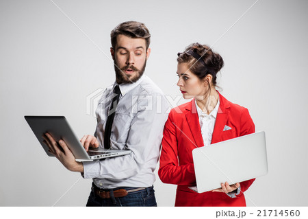 The young businessman and businesswoman with 21714560