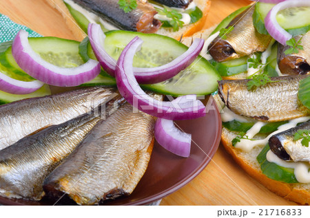 Appeizer with sprats and green cucumber 21716833