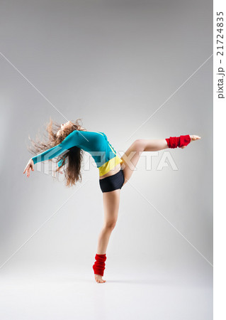 Modern style dancer  posing on grey background 21724835