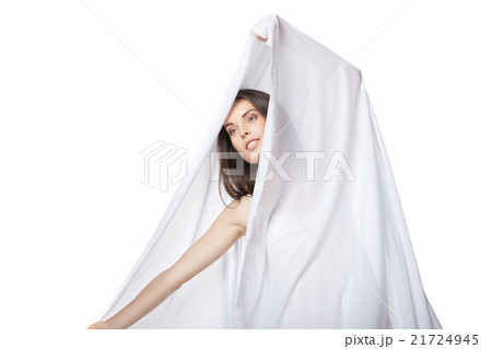 Smiling woman wearing white dress isolated 21724945