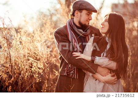 Old fashioned stylish young couple at sunset among 21735612