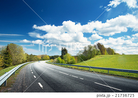 Car on asphalt road in beautiful spring day 21736725