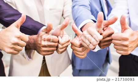 cheerful business group giving thumbs up 21738093