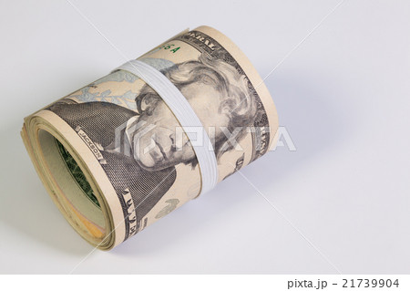 Roll of dollar bills with plastic band over eyes Roll of dollar bills with plastic band over eyes 21739904