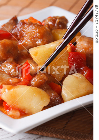 Pork meat with vegetables in sweet and sour sauce 21742789
