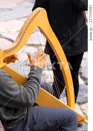 Street Musician Playing Classical Harp 21754081