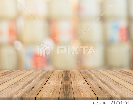Wooden board empty table blur in coffee shop 21754456