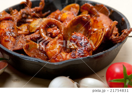 fresh seafoos stew on an iron skillet fresh seafoos stew on an iron skillet 21754831