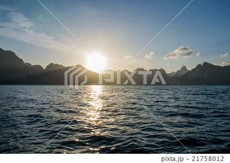 Sun rise behind mountain at Khao Sok National Park 21758012