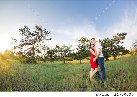 Happy young couple embrace in park 21760209