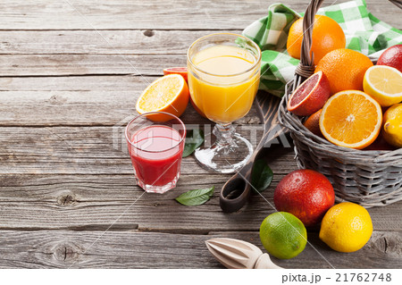 Fresh ripe citruses and juice. Lemons and oranges 21762748