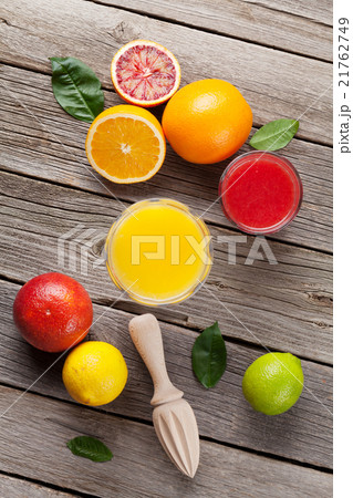 Fresh ripe citruses and juice. Lemons and oranges 21762749