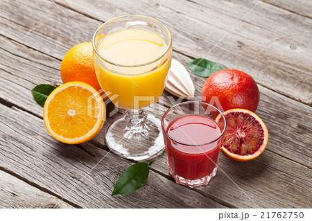 Fresh ripe citruses and juice. Lemons and oranges 21762750