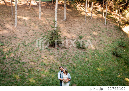beautiful couple hugging near a mountain river beautiful couple hugging near a mountain river 21763102