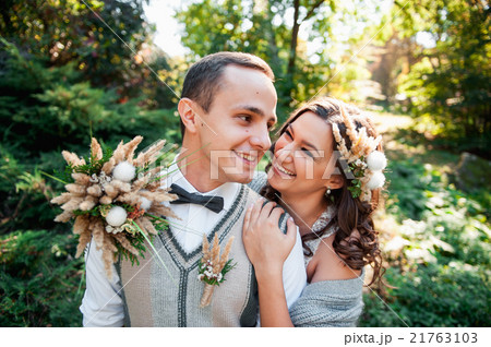 beautiful couple hugging near a mountain river beautiful couple hugging near a mountain river 21763103