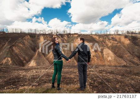 Happy couple smiling outdoors in the mountains Happy couple smiling outdoors in the mountains 21763137