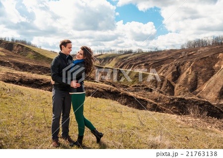 Happy couple smiling outdoors in the mountains 21763138