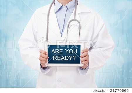 Doctor holding a tablet pc with Are you ready sign 21770666