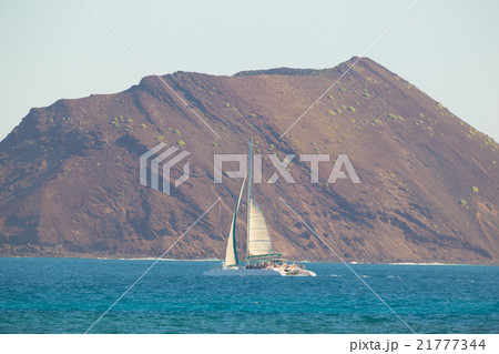 Catamarans cruising the blue sea. Catamarans cruising the blue sea. 21777344