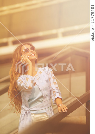 Businesswoman talking over mobile phone 21779481
