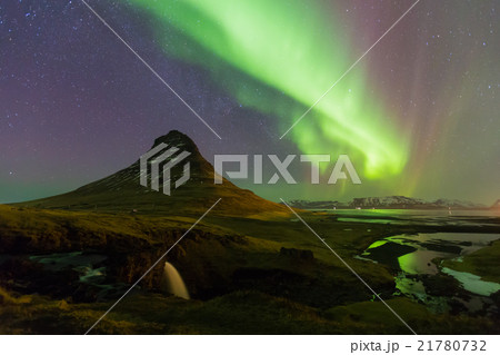 Northern lights over Kirkjufell volcano  Northern lights over Kirkjufell volcano  21780732