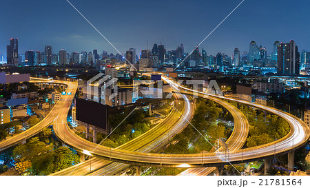 Aerial view highway road curved with city 21781564
