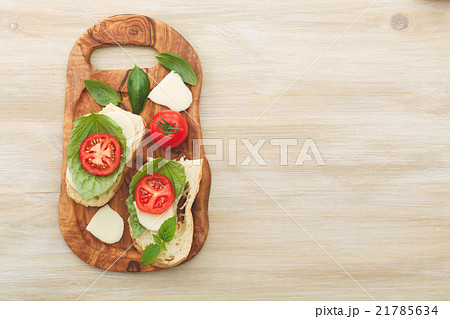 Sandwiches with mascarpone, dried tomatoes, basil 21785634
