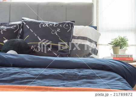 modern bedroom with black pillows on bed 21789872