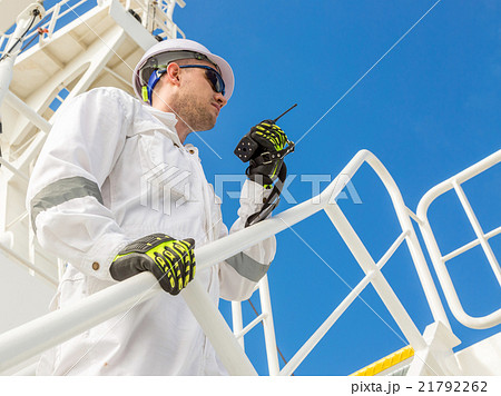 Engineer with VHF under blue sky Engineer with VHF under blue sky 21792262
