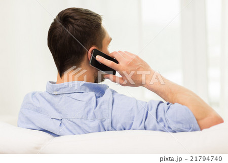 close up of man calling on smartphone at home close up of man calling on smartphone at home 21794740
