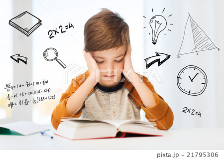 student boy reading book or textbook at home student boy reading book or textbook at home 21795306
