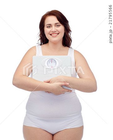 happy young plus size woman holding scales happy young plus size woman holding scales 21795566