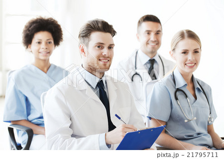 group of happy doctors on seminar at hospital group of happy doctors on seminar at hospital 21795711