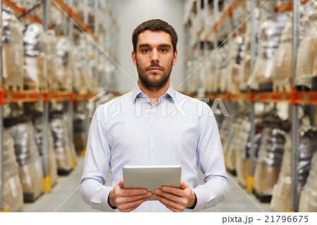 businessman with tablet pc at warehouse 21796675