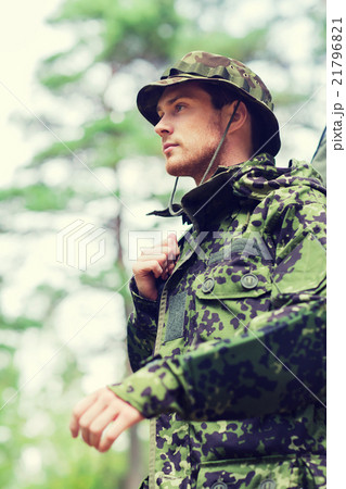 young soldier or hunter with gun in forest young soldier or hunter with gun in forest 21796821