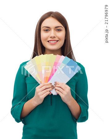smiling young woman with color swatches 21796979