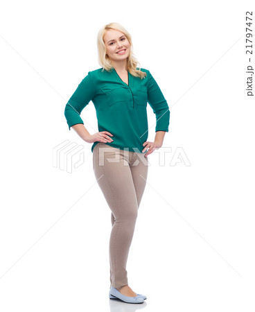 smiling young woman in shirt and trousers 21797472