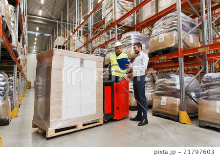 worker on forklift and businessman at warehouse worker on forklift and businessman at warehouse 21797603
