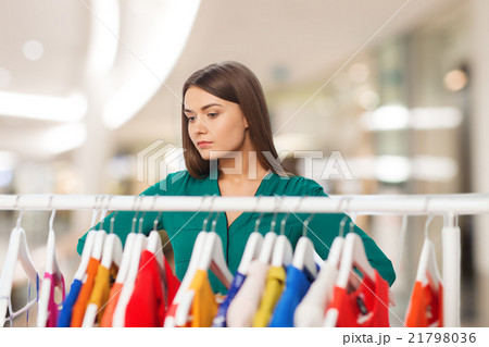 woman choosing clothes at home wardrobe woman choosing clothes at home wardrobe 21798036